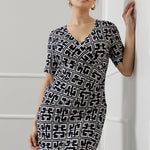 Elevate your wardrobe with the Leah Dress, expertly crafted from our signature dry-touch stretch jersey that delivers all-day comfort with a polished finish. Designed for seamless transitions from the office to evening events and weekend outings, this versatile dress features a flattering fixed wrap bodice, a sophisticated knee-length tulip skirt, and above-elbow sleeves that strike the perfect balance between coverage and style.