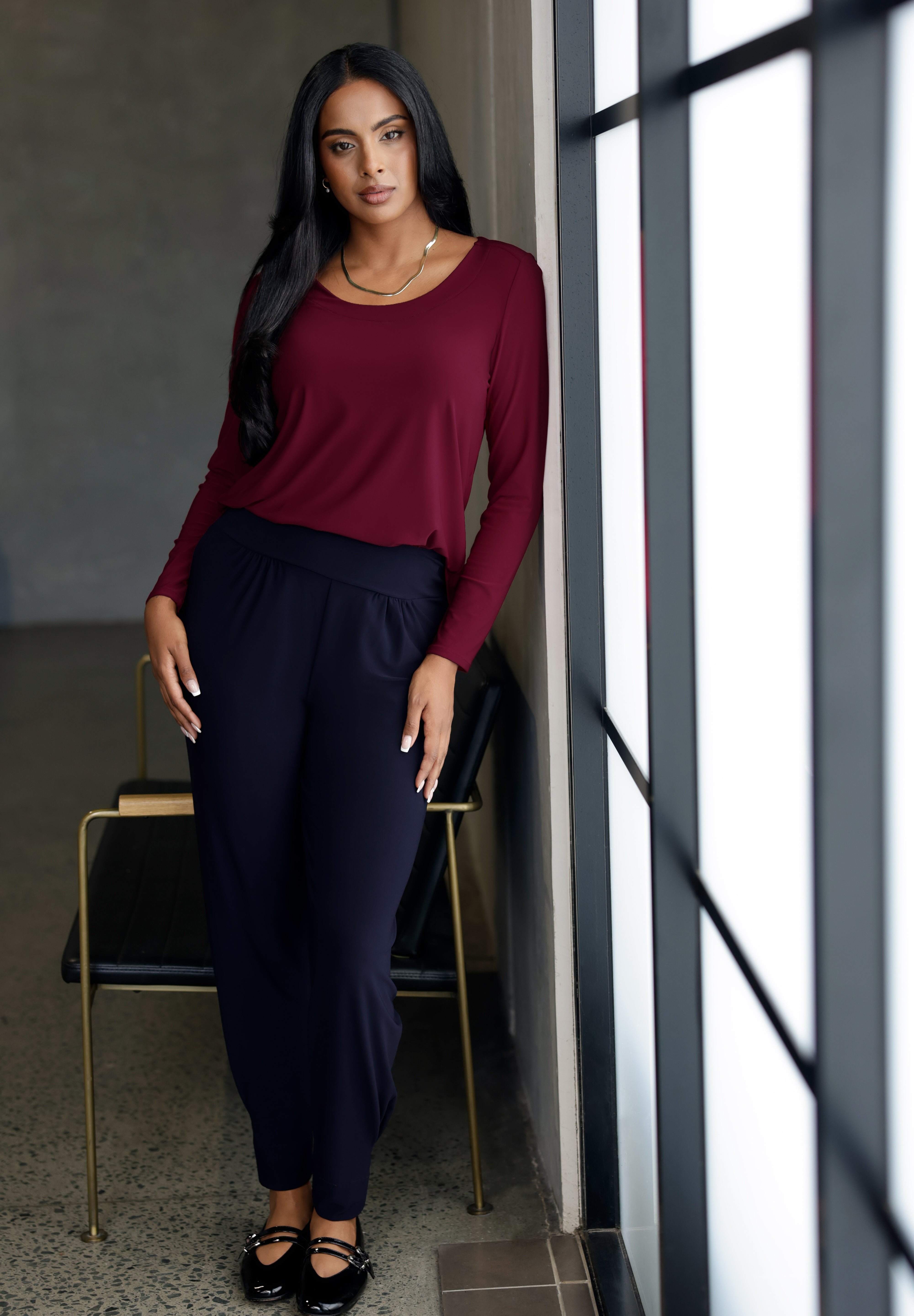 The Leith Top in Ruby is the long-sleeve evolution of our beloved Jules Top, designed for ultimate comfort and layering ease. Perfect as a standalone piece or worn under jackets and knitwear, this fitted women’s top is a must-have staple for cooler days and transitional weather. Proudly Australian made and available in sizes 8 to 24, it’s crafted from a soft-stretch, dry-touch jersey that feels as good as it looks.