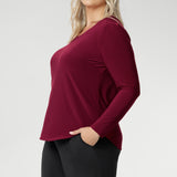 The Leith Top in Ruby is the long-sleeve evolution of our beloved Jules Top, designed for ultimate comfort and layering ease. Perfect as a standalone piece or worn under jackets and knitwear, this fitted women’s top is a must-have staple for cooler days and transitional weather. Proudly Australian made and available in sizes 8 to 24, it’s crafted from a soft-stretch, dry-touch jersey that feels as good as it looks.