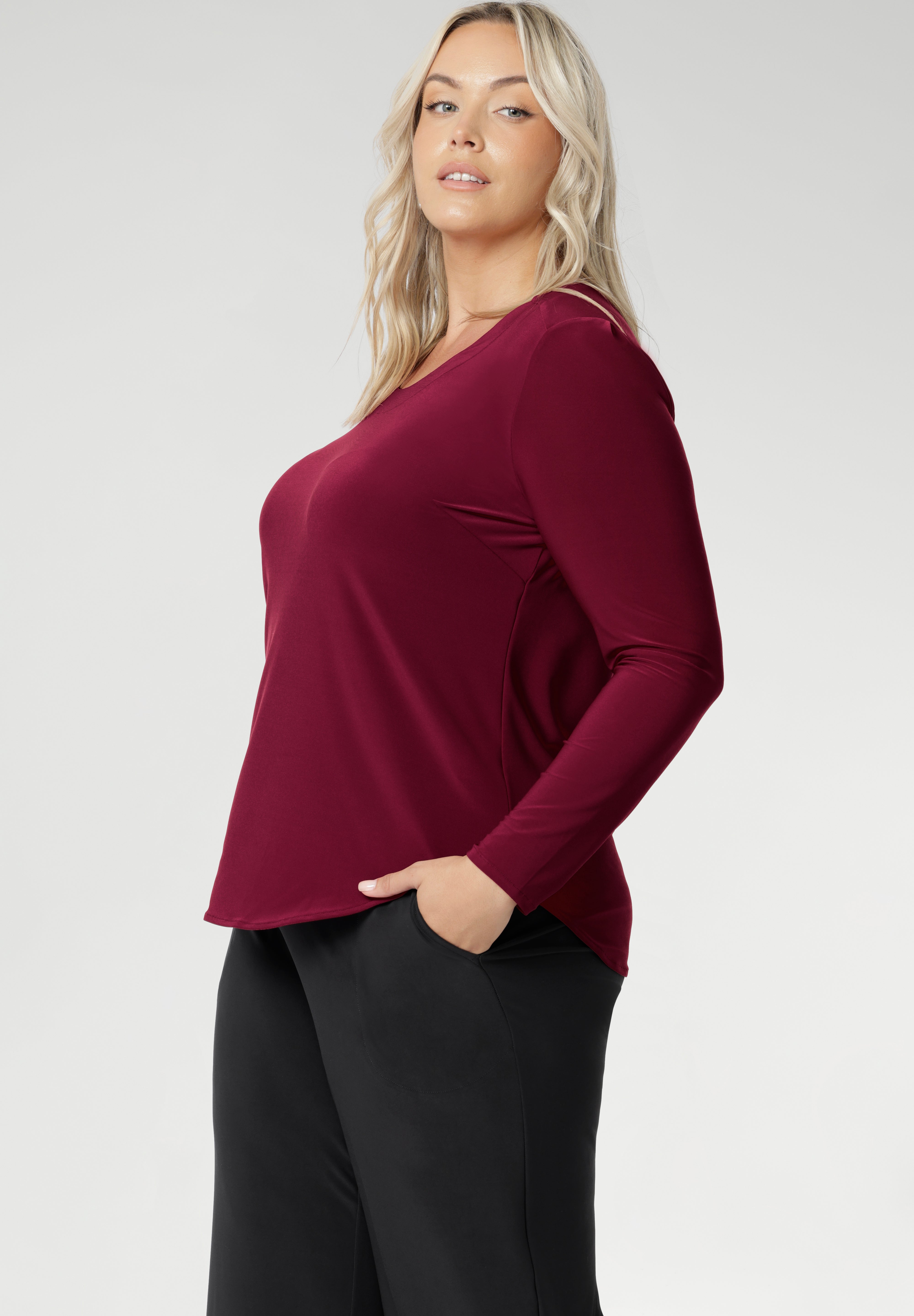The Leith Top in Ruby is the long-sleeve evolution of our beloved Jules Top, designed for ultimate comfort and layering ease. Perfect as a standalone piece or worn under jackets and knitwear, this fitted women’s top is a must-have staple for cooler days and transitional weather. Proudly Australian made and available in sizes 8 to 24, it’s crafted from a soft-stretch, dry-touch jersey that feels as good as it looks.