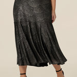A size 10, petite height woman wears a midi length, foil print evening skirt with ruffle hem. For cocktail and evening wear, this elegant skirt is made in Australia by women's fashion brand, Leina & Fleur. Shop their evening and cocktail wear online in sizes 8 to 24.