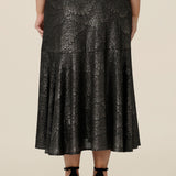 Back view of a midi length, foil print evening skirt with ruffle hem. For cocktail and evening wear, this elegant skirt is made in Australia by women's fashion brand, Leina & Fleur. Shop their evening and cocktail wear online in sizes 8 to 24.