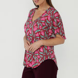 Lila Top in premium dry-touch jersey with soft stretch, showcasing a flattering V-neck, delicate flutter sleeves and effortless work-to-weekend versatility