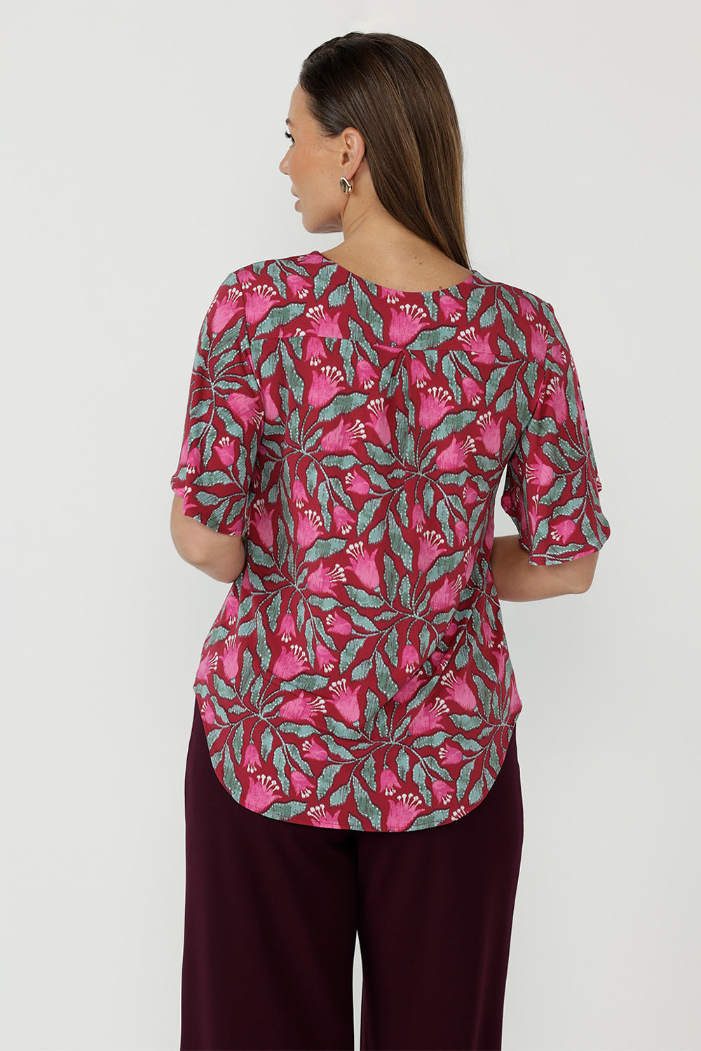 Refined Lila Top crafted from signature stretch jersey fabric with elegant flutter sleeves, a centre-back tuck for movement and a polished Australian-made finish.