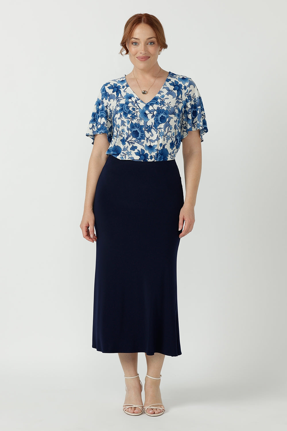 Elegant Lila Top featuring a textured embroidered jersey fabric, V-neckline with stitching detail and softly draped flutter sleeves.
