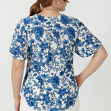Lila women's top crafted from soft stretch embroidered jersey, featuring elegant flutter sleeves, bust darts and a gently curved shirttail hem.