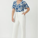 Versatile Australian-made Lila Top featuring soft stretch fabric, delicate embroidered detailing and flutter sleeves that gently cover the upper arms.