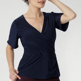  With short sleeves and a versatile silhouette, it layers effortlessly under jackets or stands alone as a polished summer essential.