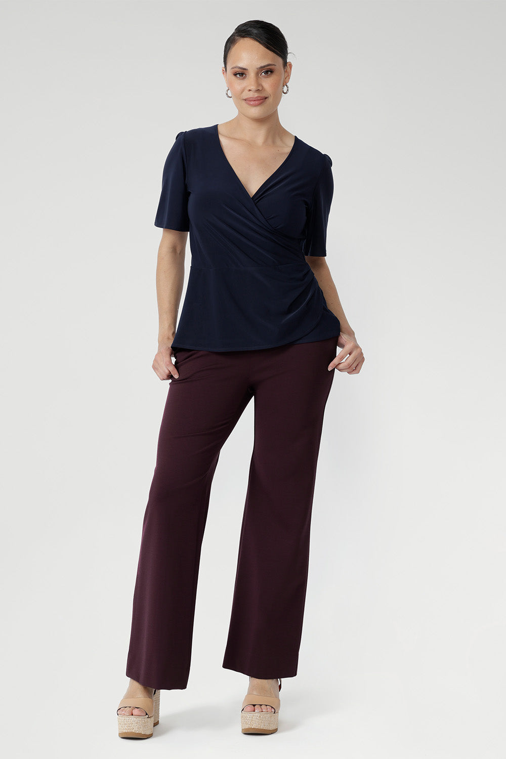 With short sleeves and a versatile silhouette, it layers effortlessly under jackets or stands alone as a polished summer essential.
