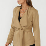 Elegant Lyndon wrap jacket crafted from luxe Modal fabric with a fluid drape, adjustable waist tie and refined tailoring for elevated everyday dressing.