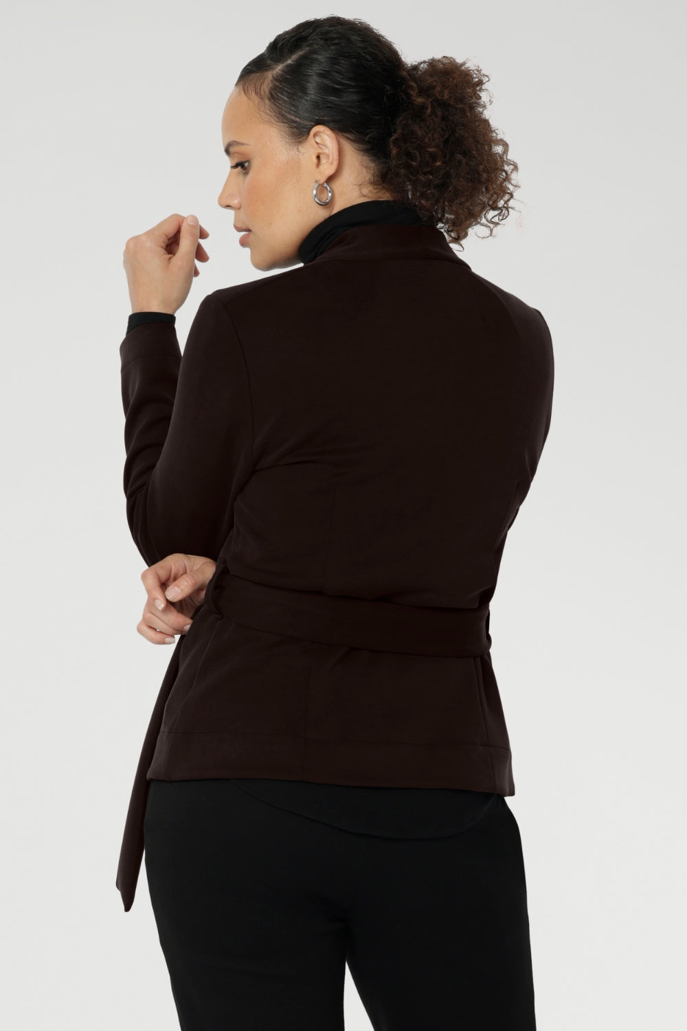 The Lyndon features a flattering wrap-style silhouette with angled front panels that drape beautifully, and tailored darts at the back to enhance shape. 