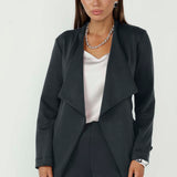 This versatile women’s wrap jacket is perfect for layering over both workwear and occasion outfits.