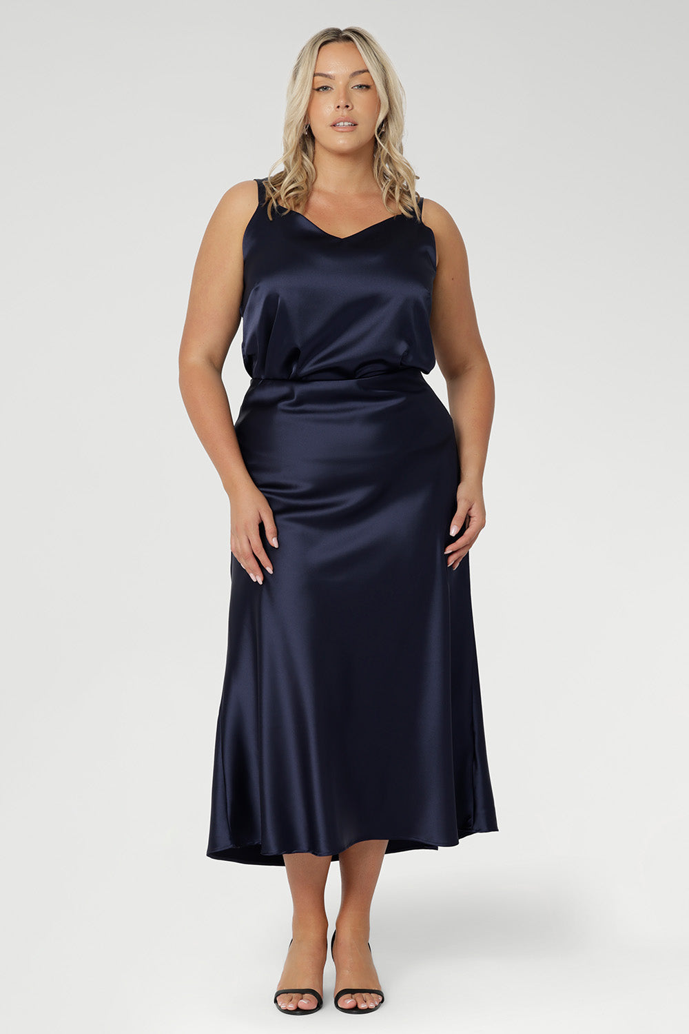 With a pull-on elastic waist, A-line shape, and soft stretch satin finish, it’s designed for all-day wear and effortless styling.