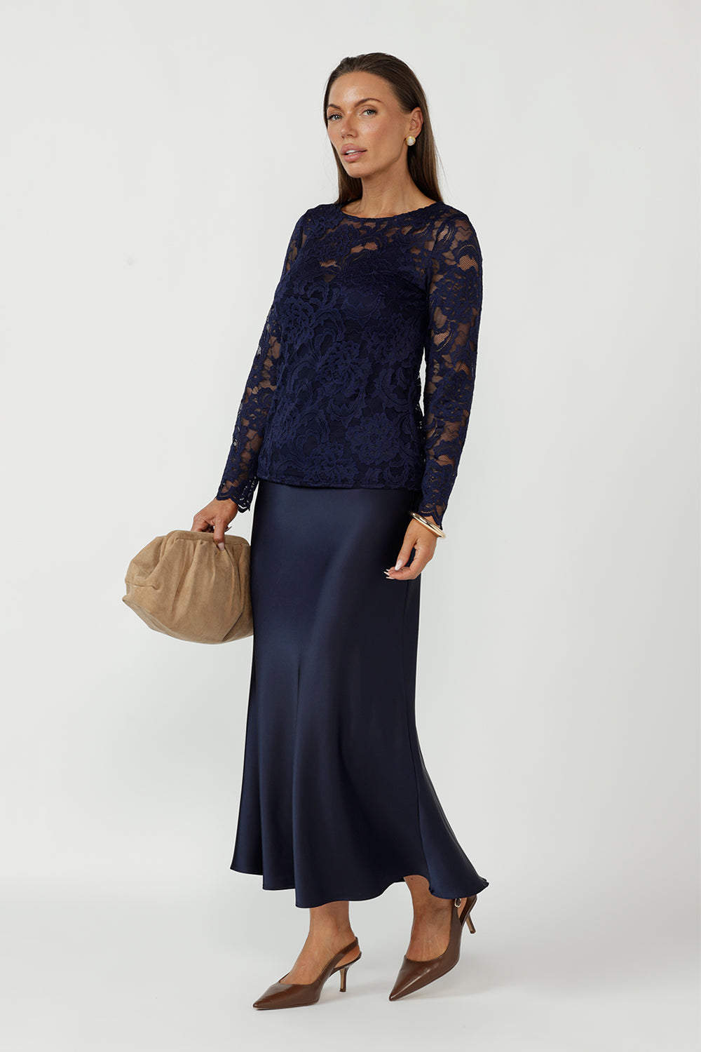 A modern take on soft tailoring for women, the Manhattan Maxi Skirt features a bias-cut design, elastic waist, and elegant drape. Crafted from stretch satin, it’s a versatile, travel-friendly piece for workwear, evenings, and special occasions.
