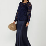 A modern take on soft tailoring for women, the Manhattan Maxi Skirt features a bias-cut design, elastic waist, and elegant drape. Crafted from stretch satin, it’s a versatile, travel-friendly piece for workwear, evenings, and special occasions.