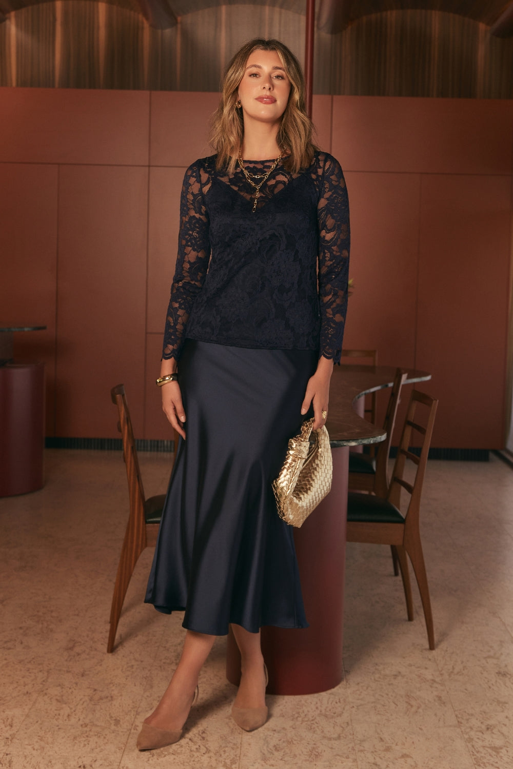 The Manhattan Maxi Skirt is a refined essential for women’s workwear Australia and occasion dressing, crafted from luxurious stretch satin with a soft sheen. 