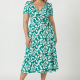 Timeless wrap dress in signature dry-touch jersey, designed with extended waist ties, a flowing A-line skirt and soft stretch fabric for effortless comfort.