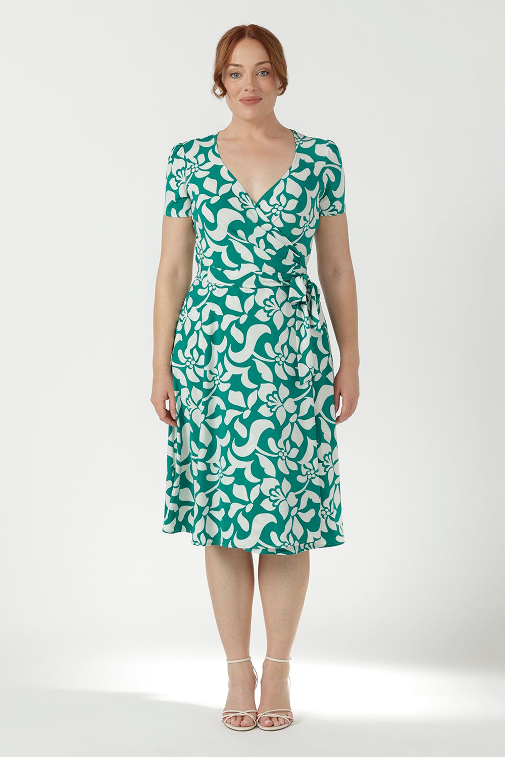 Elegant women's wrap dress crafted from soft stretch dry-touch jersey, featuring a flattering wrap bodice, adjustable waist ties and a flowing A-line skirt.