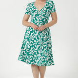 Flattering women's wrap dress featuring a functioning wrap bodice, adjustable waist ties, softly gathered sleeve heads and a graceful A-line skirt.