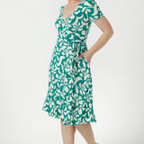 Australian-made women's wrap dress featuring a feminine wrap neckline, softly gathered sleeves, practical side pockets and a flattering waist-defining silhouette.