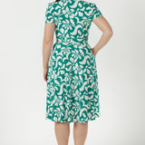 Versatile Australian-made wrap dress crafted from soft stretch jersey, featuring a defined waist, feminine sleeve detailing and functional side pockets.