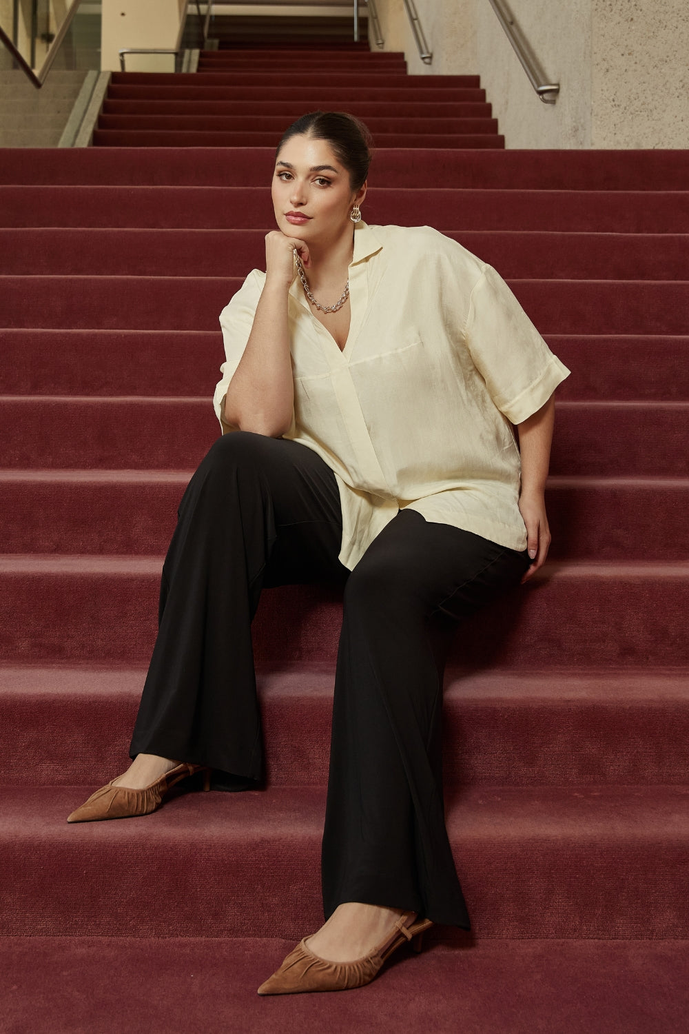 Elegant Martha Shirt with a fluid oversized silhouette, wide below-elbow sleeves and centre-front hem split for versatile tucked or untucked styling.