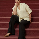 Elegant Martha Shirt with a fluid oversized silhouette, wide below-elbow sleeves and centre-front hem split for versatile tucked or untucked styling.