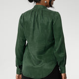 Crafted from suede touch Tencel that has a luxurious feel and drape. Proudly made in Australia in sizes 8-24. The Matisse Shirt in Deep Green is a pull-on style with a tie neckline, crafted from soft, fluid fabric. Blouson sleeves and buttoned cuffs add a polished finish. Matisse is a semi-fitted pull on style V-neckline shirt with extended neck ties, back pleats and bishop sleeves.