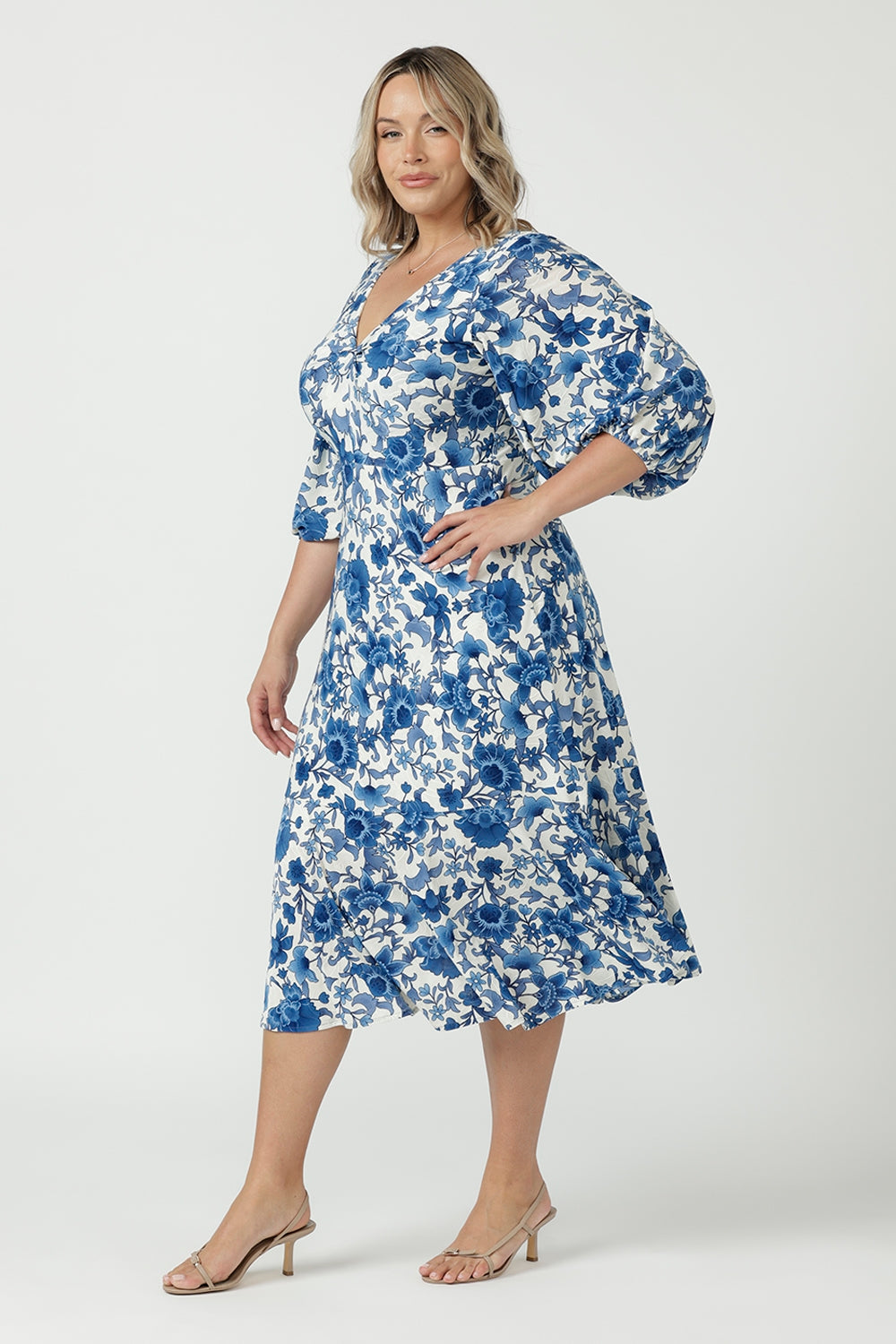 Australian-made Melina Dress featuring a feminine twist-front bodice, statement lantern sleeves with elasticated cuffs and a beautifully flowing skirt.