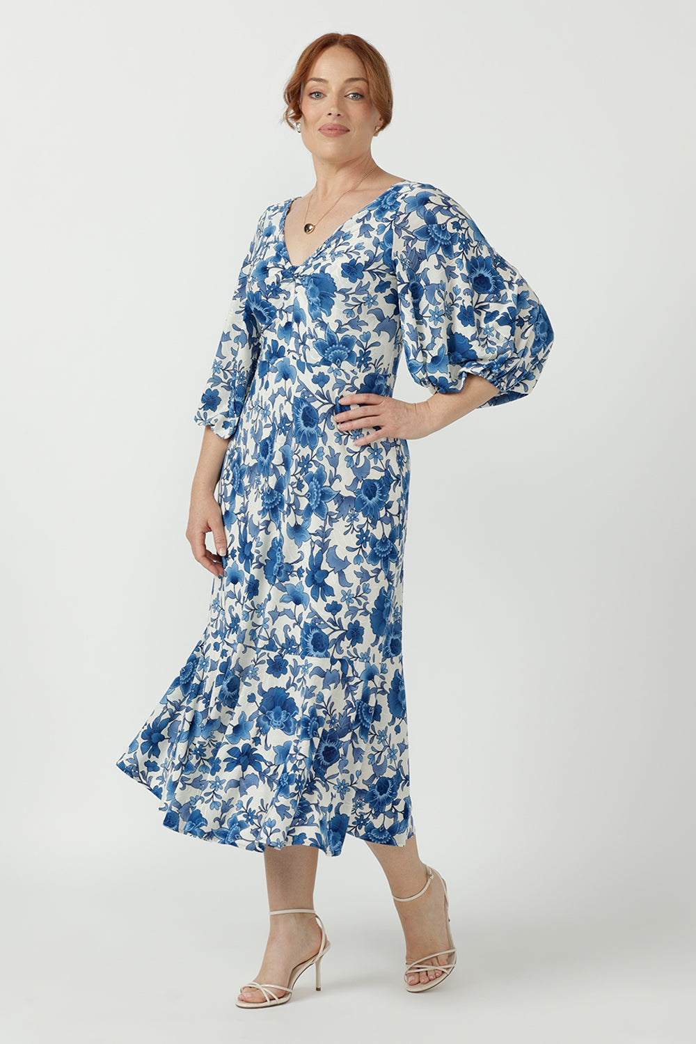Australian-made Melina Dress designed with a flattering V-shaped back, double-layer twist-front bodice, softly gathered lantern sleeves and a lined flowing skirt.