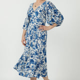 Australian-made Melina Dress designed with a flattering V-shaped back, double-layer twist-front bodice, softly gathered lantern sleeves and a lined flowing skirt.