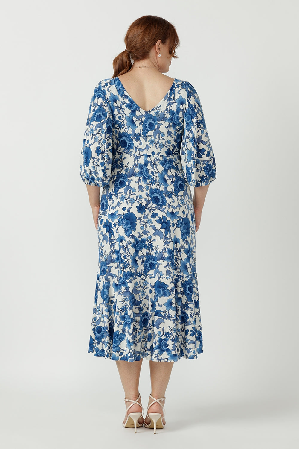 Sophisticated women's Melina Dress in textured embroidered jersey, designed with a flattering empire waist, double-layer bodice and deep ruffle hem.