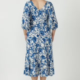 Sophisticated women's Melina Dress in textured embroidered jersey, designed with a flattering empire waist, double-layer bodice and deep ruffle hem.