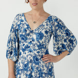 Flattering empire-line Melina Dress with a twist-front neckline, voluminous lantern sleeves, elasticated cuffs and an elegant ruffle hem.