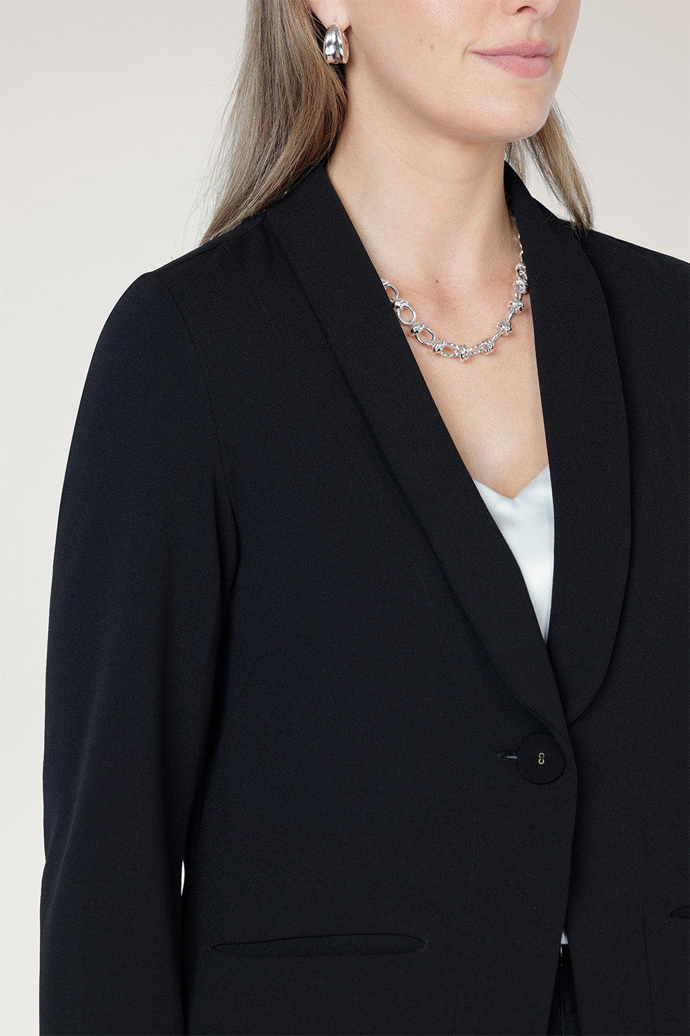Perfect for work, Merit features a button front, full-length sleeves with foldable cuffs, and an extended shawl collar, offering versatile style and comfort. Available in sizes 8-24.