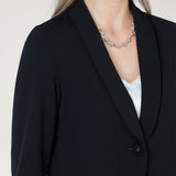 Perfect for work, Merit features a button front, full-length sleeves with foldable cuffs, and an extended shawl collar, offering versatile style and comfort. Available in sizes 8-24.