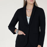 Perfect for work, Merit features a button front, full-length sleeves with foldable cuffs, and an extended shawl collar, offering versatile style and comfort.