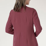Designed in a longline, relaxed fit, it features an extended shawl collar that creates a refined, elongating silhouette. 