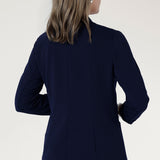 Perfect for work, Merit features a button front, full-length sleeves with foldable cuffs, and an extended shawl collar, offering versatile style and comfort.