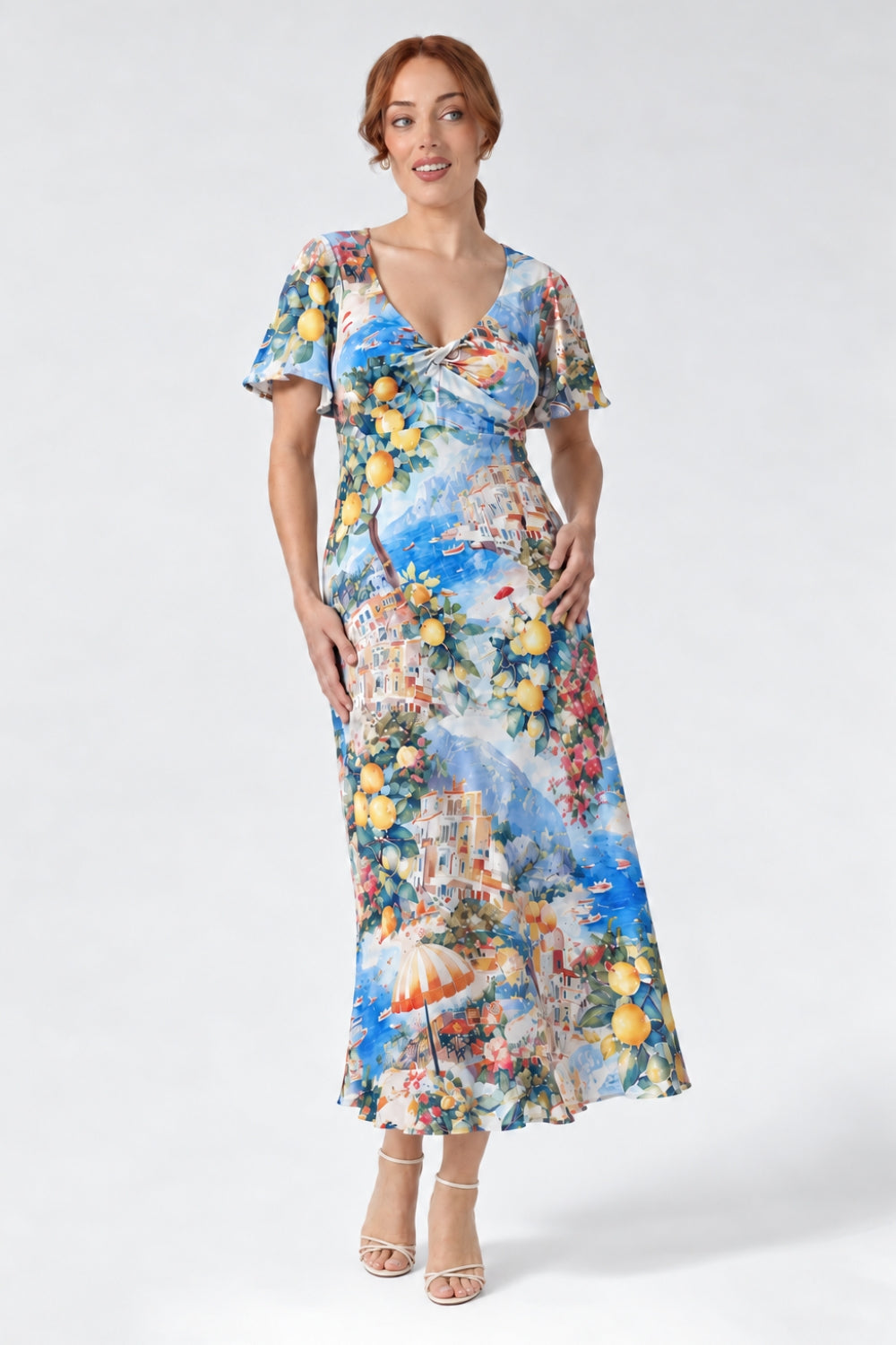 Discover the limited-edition Mica Maxi Dress in Limoncello, featuring a vibrant Italian-inspired print, flattering twist V-neck and flowing silhouette. Australian-made elegance for weddings and special occasions. Available in sizes 8-24 for a limited time only.