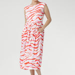 Designed in a flattering midi length, it features a sleeveless round-neck bodice and a softly gathered A-line skirt with side pockets for ease and functionality. 