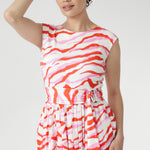 The vibrant abstract print combines pink and red tones on a soft vanilla base, bringing playful energy to warm days. Finished with a coordinating belt to define the waist. Made in Australia with integrity.