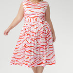 The vibrant abstract print combines pink and red tones on a soft vanilla base, bringing playful energy to warm days. Finished with a coordinating belt to define the waist. Made in Australia with integrity.