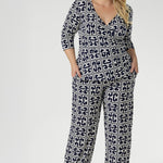 A timeless straight-leg pant designed to move effortlessly from the office to the weekend. Shown here, our size 18 model wears the Kyle Top in Ink Olympia paired with the matching Monroe Pant in Ink Olympia, styled together for a chic, printed jumpsuit effect. Available in sizes 8 to 24, with a choice of three leg lengths for the perfect fit.