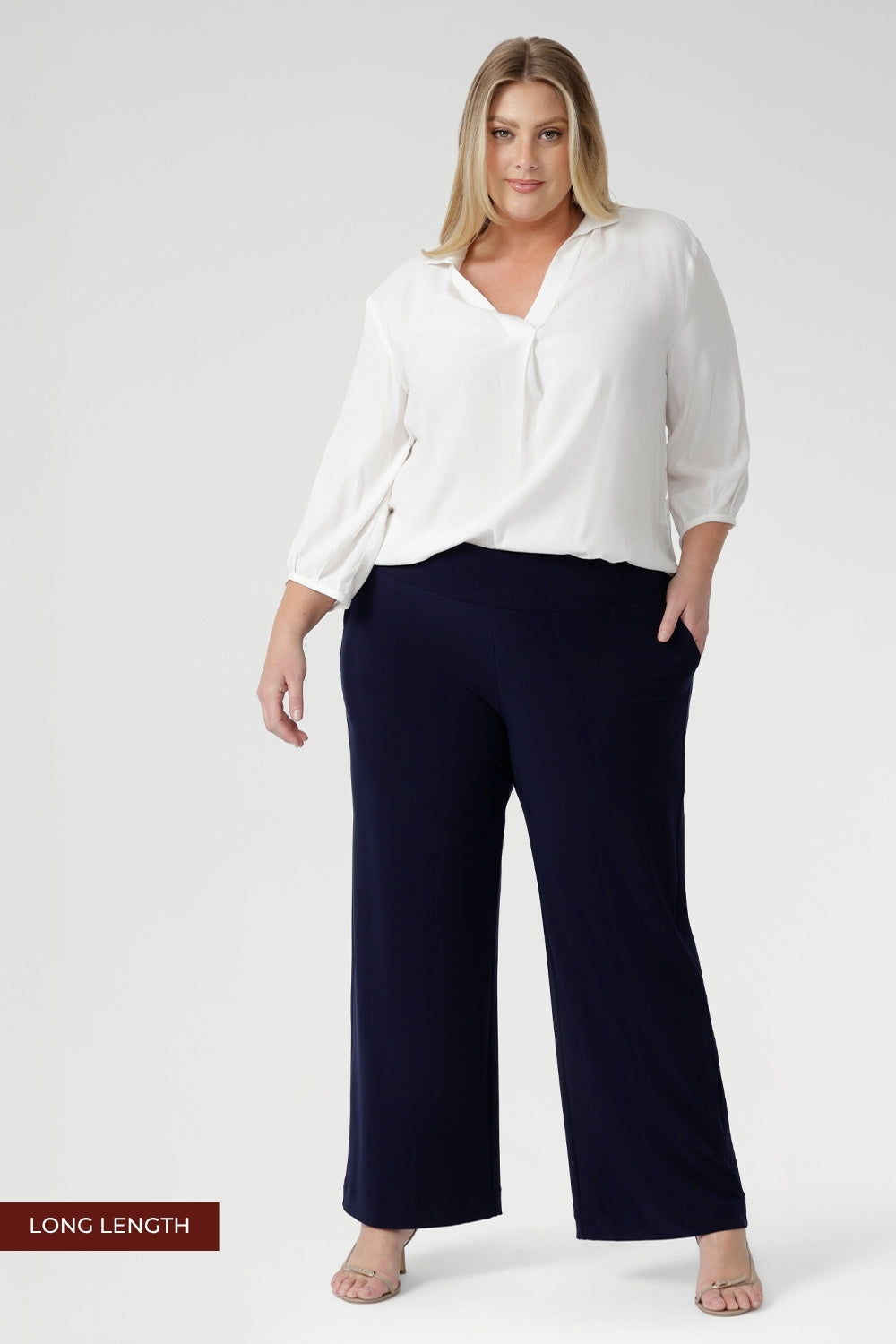 The clean straight-leg cut and deep hem create a modern, elongated line that works seamlessly from work to weekend.