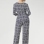 A timeless straight-leg pant designed to move effortlessly from the office to the weekend. Shown here, our size 10 model wears the Kyle Top in Ink Olympia paired with the matching Monroe Pant in Ink Olympia, styled together for a chic, printed jumpsuit effect. Available in sizes 8 to 24, with a choice of three leg lengths for the perfect fit.