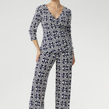 The classic straight-leg pant that transitions seamlessly from workwear to weekend. Size 10 model wears Kyle Top in Ink Olympia with matching Monroe Pant in Ink Olympia to create a printed jumpsuit set. Sizes 8-24 available and 3 leg lengths to choose from.