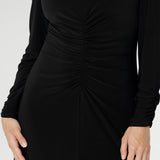 A flattering V-neckline, subtle gathering through the front and back, and shelf lining at the bust create a polished yet comfortable fit. Available in sizes 8–24.