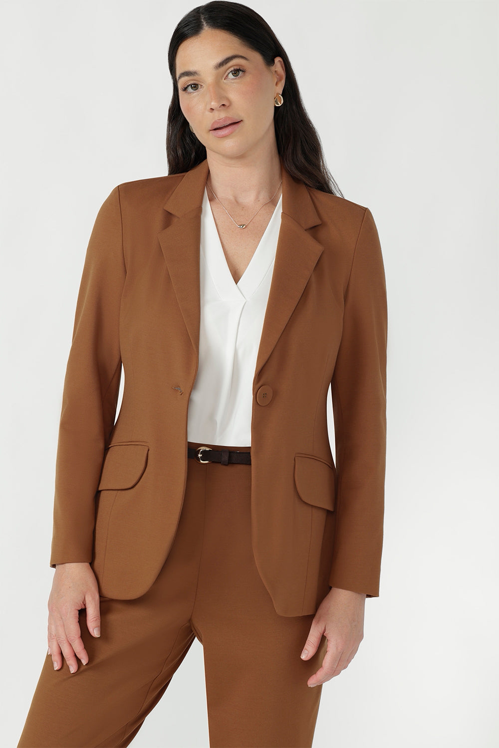 Close-up of the toffee Longline Tailored Jacket double-layer front panels and front welt pocket with flap.