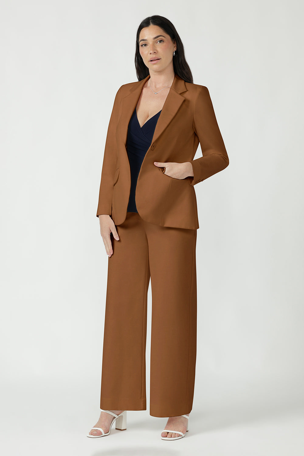 Back view of the toffee Longline Tailored Jacket showing tailored back panels and a back vent.